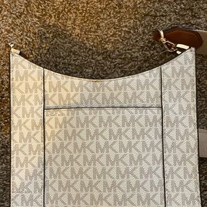 MK crossbody with adjustable strap.